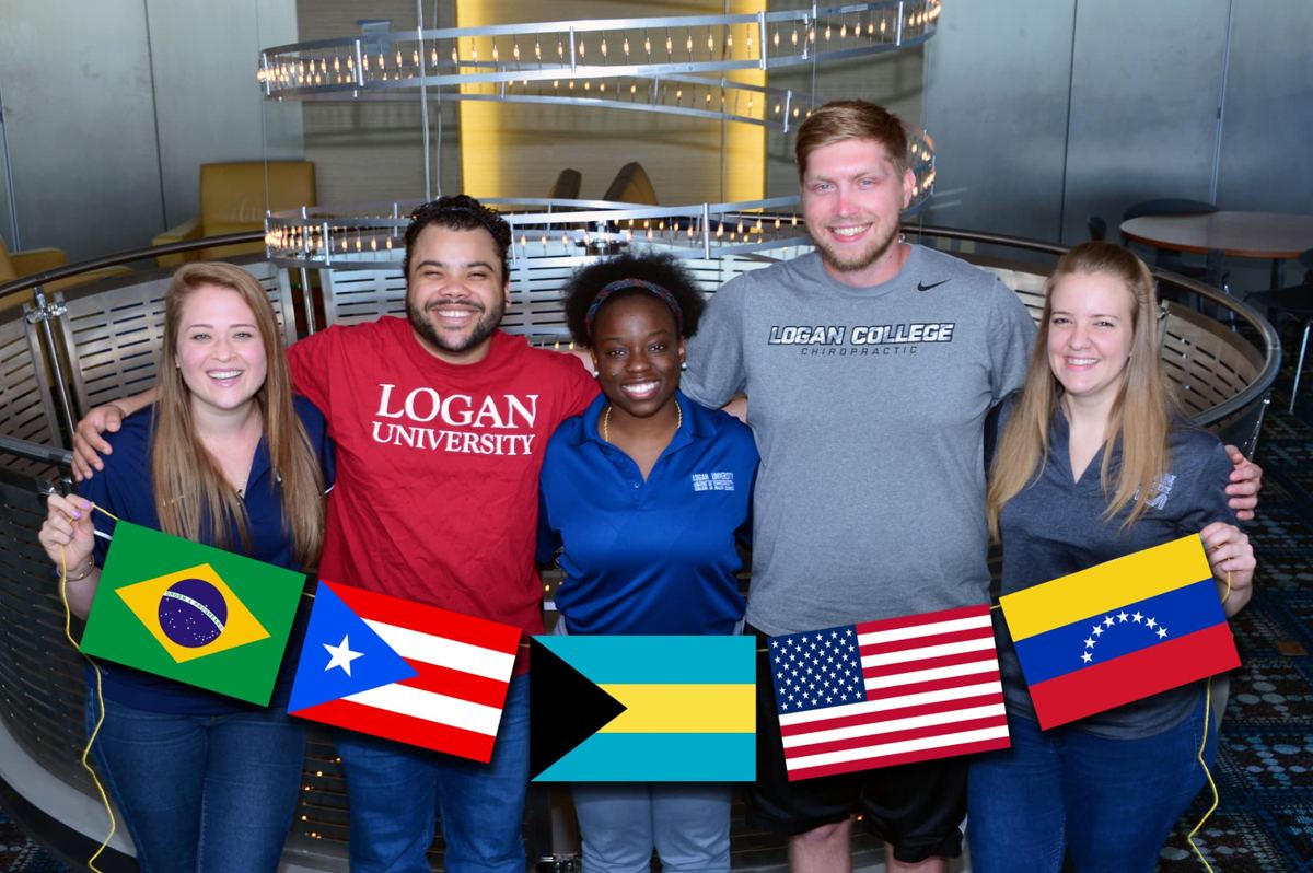 Logan students holding the flags of their home countries on campus